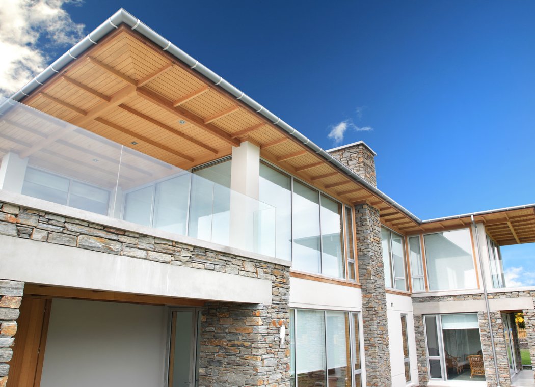 Stone and timber home with aluminium windows and doors